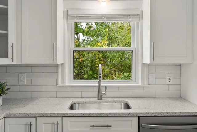 a kitchen with a sink and a window