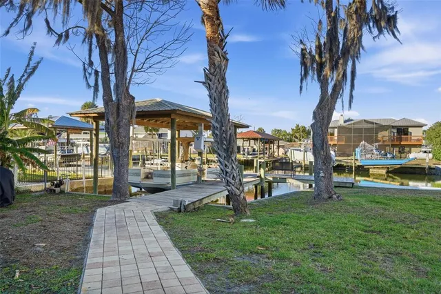 a dining room with furniture a chandelier and window
