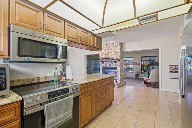 a patio with a table and chairs under an umbrella