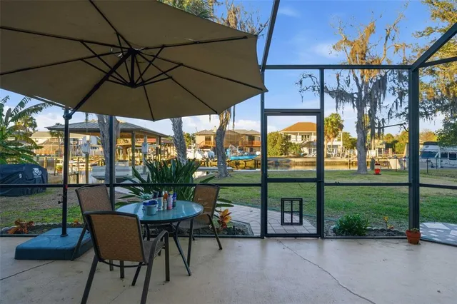 an empty room with a ceiling fan and a window