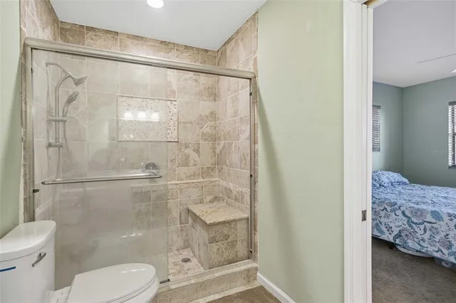 a view of a hallway with a white wooden cabinets