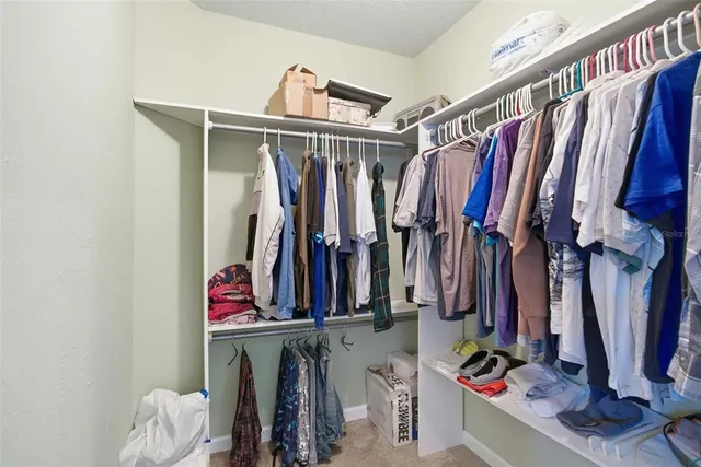 a view of a livingroom with furniture and a garage