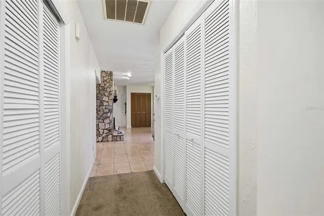 an aerial view of a house with a lake view