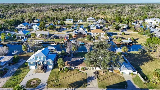 an aerial view of a house with swimming pool and outdoor space