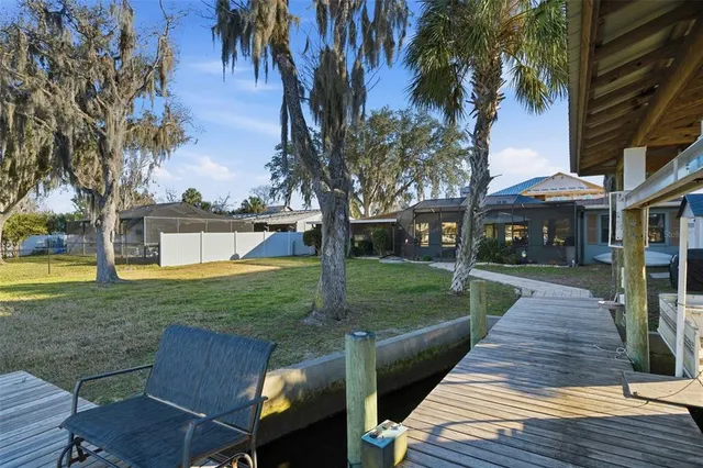 a view of a lake with a house in the background