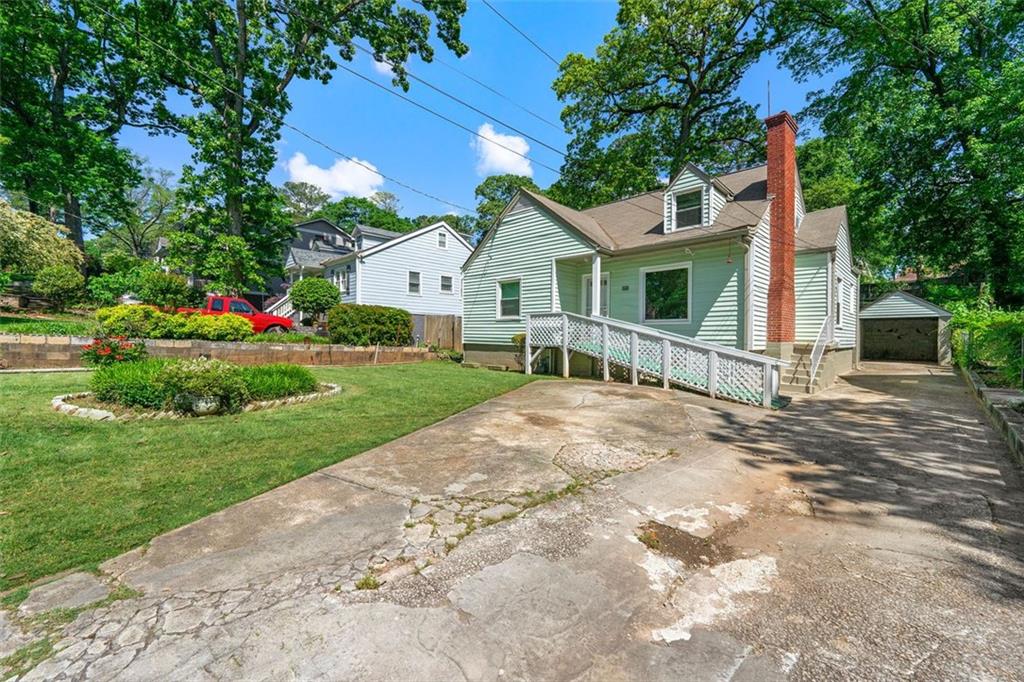 460 Chevelle Lane Decatur, GA 30030 - Photo 1 of 1 a front view of a house with a yard and garage