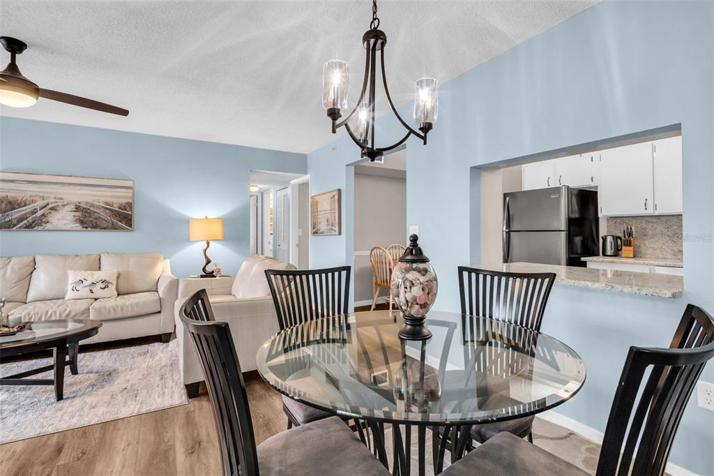 2523 Pine Ridge Way South, Unit C2 Palm Harbor, FL 34684 - Photo 11 of 29 a view of dining room and hall with furniture