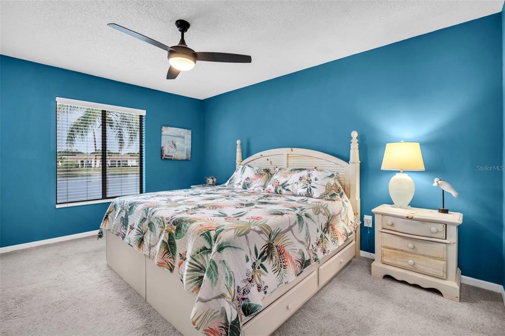 2523 Pine Ridge Way South, Unit C2 Palm Harbor, FL 34684 - Photo 16 of 29 a bedroom with bed and a window