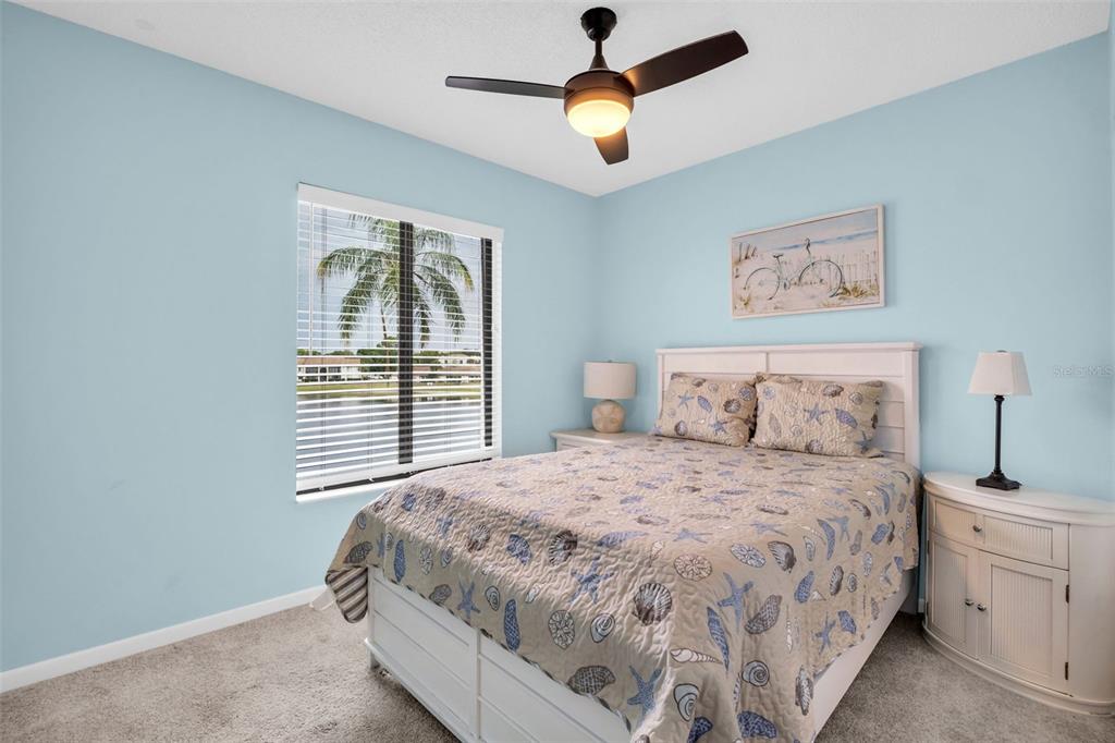 2523 Pine Ridge Way South, Unit C2 Palm Harbor, FL 34684 - Photo 21 of 29 a bedroom with a bed and a window