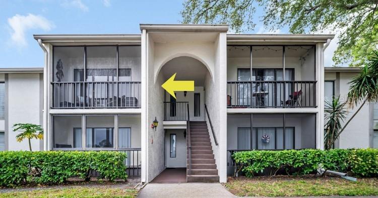 2523 Pine Ridge Way South, Unit C2 Palm Harbor, FL 34684 - Photo 25 of 29 a house view with a garden space