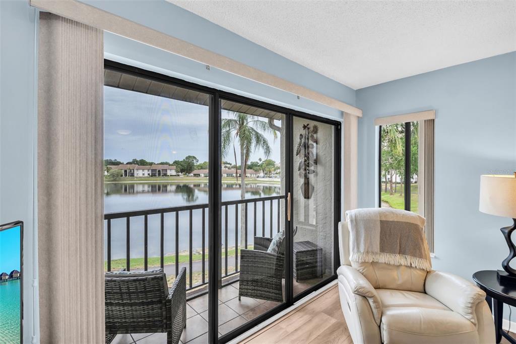 2523 Pine Ridge Way South, Unit C2 Palm Harbor, FL 34684 - Photo 6 of 29 a living room with furniture and a window