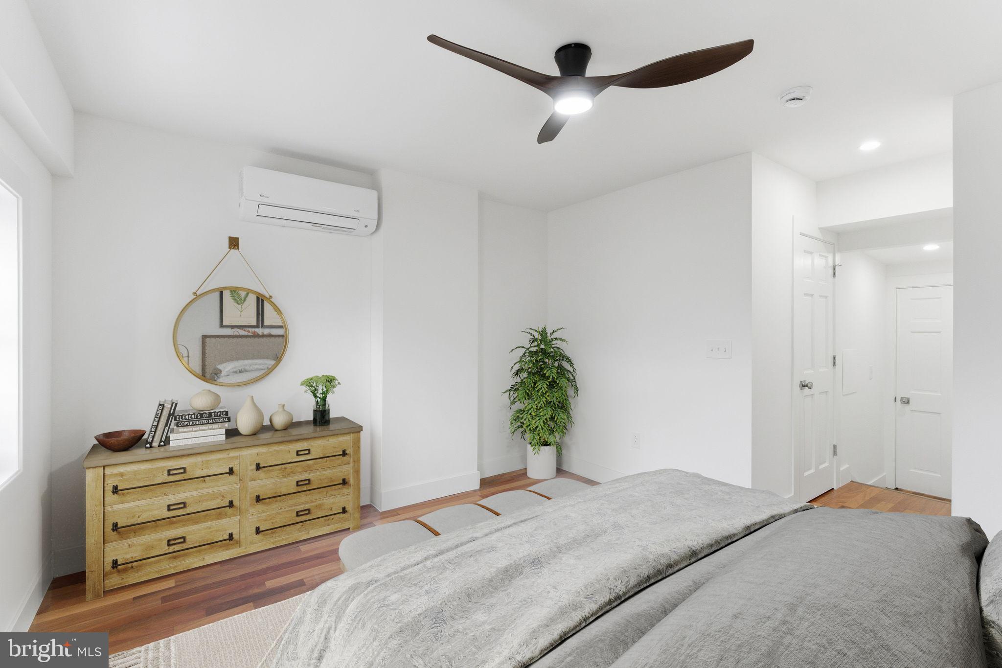 38 East 6th Street Frederick, MD 21701 - Photo 27 of 46 a bedroom with a bed and a mirror on the dresser