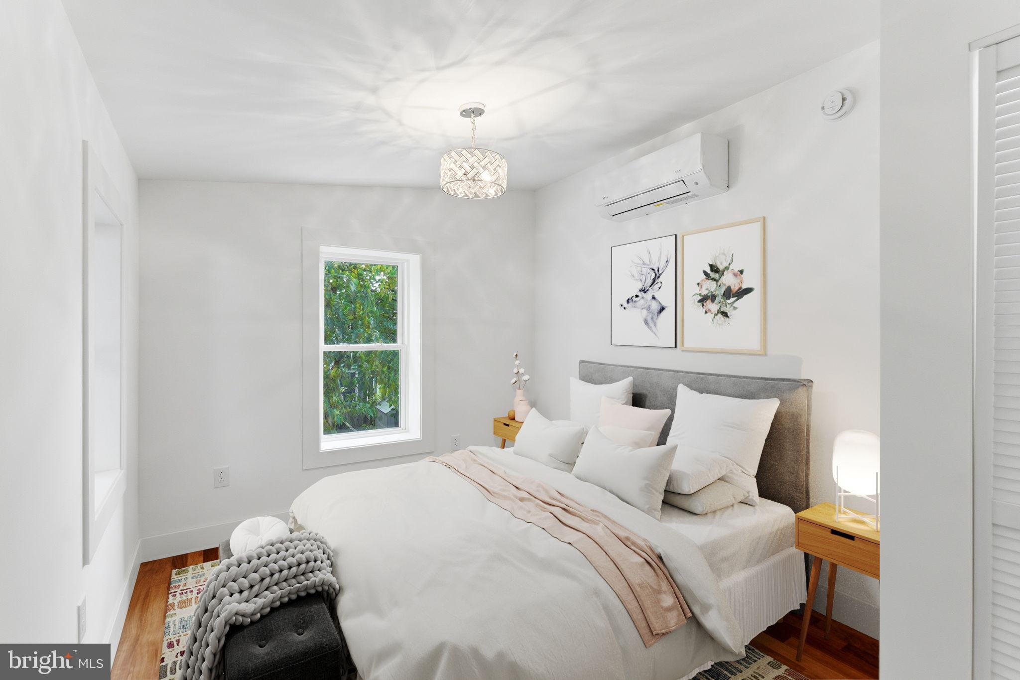 38 East 6th Street Frederick, MD 21701 - Photo 31 of 46 a bedroom with a bed and a window