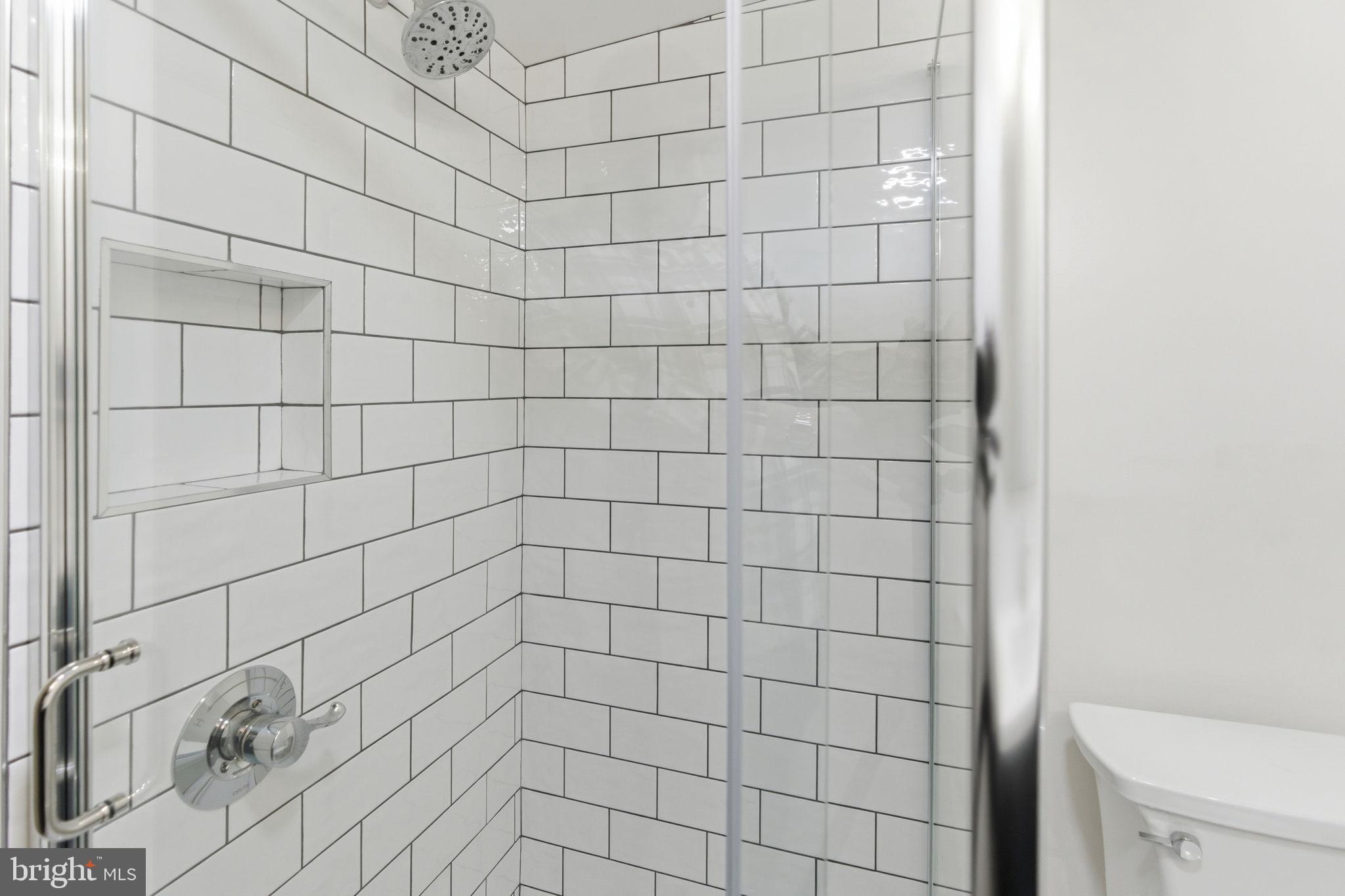 38 East 6th Street Frederick, MD 21701 - Photo 37 of 46 a bathroom with a shower