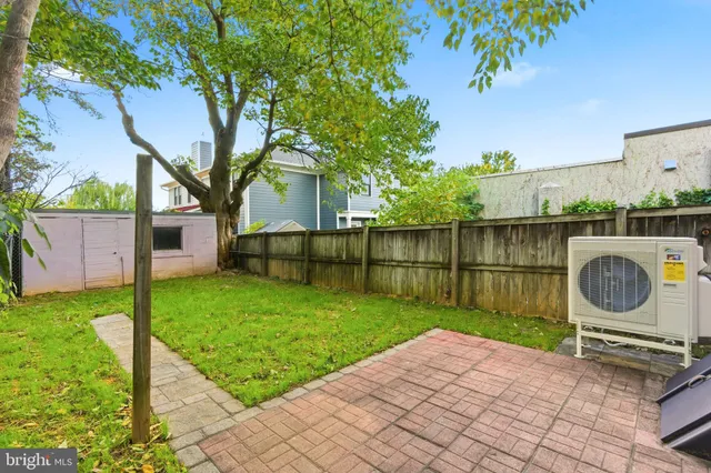 a view of a backyard with a garden and plants