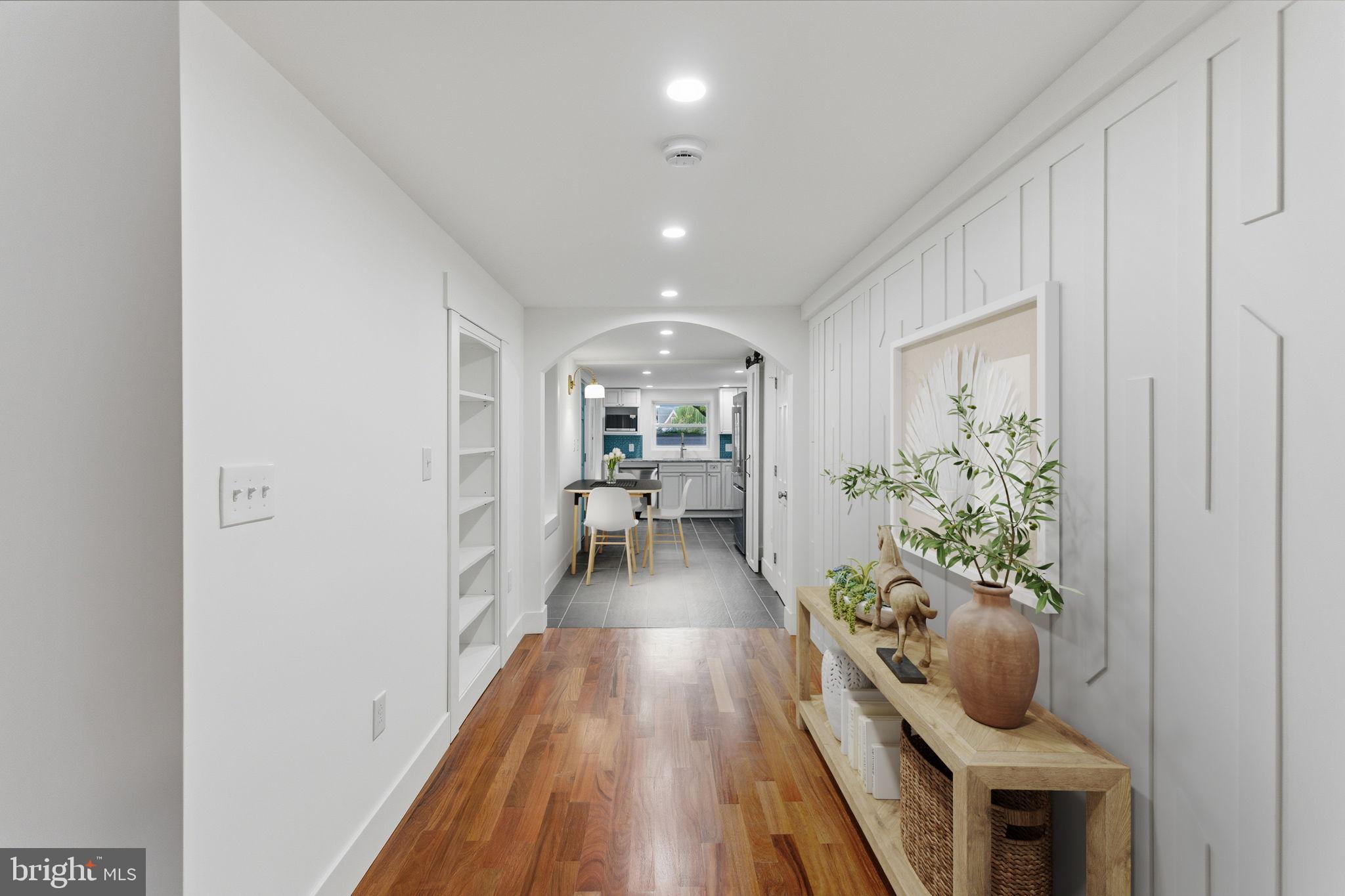 38 East 6th Street Frederick, MD 21701 - Photo 9 of 46 a living room with furniture and a wooden floor