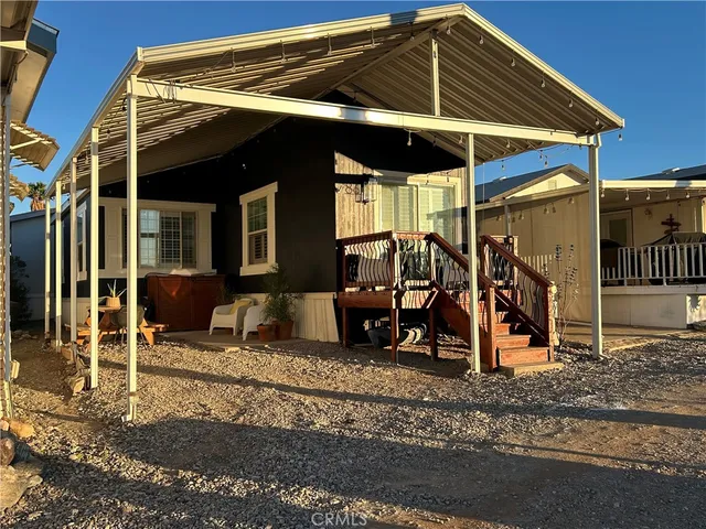 a view of a chairs and table in the patio