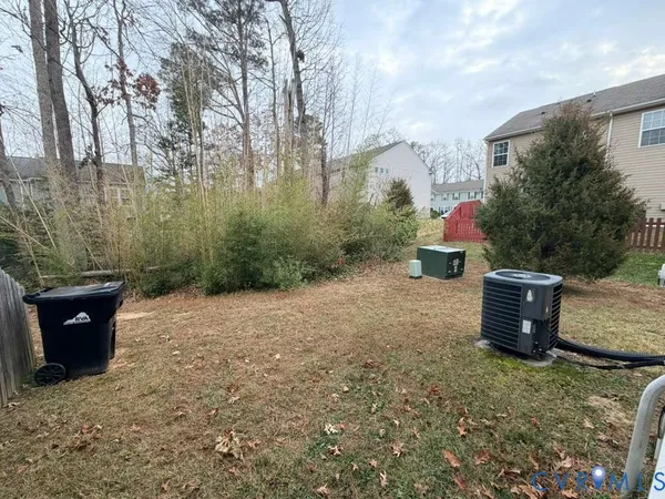 a backyard of a house with lots of green space