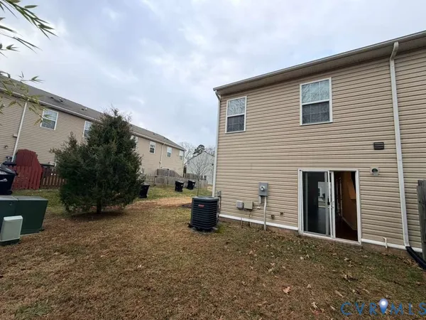 a view of a house with a yard and garage