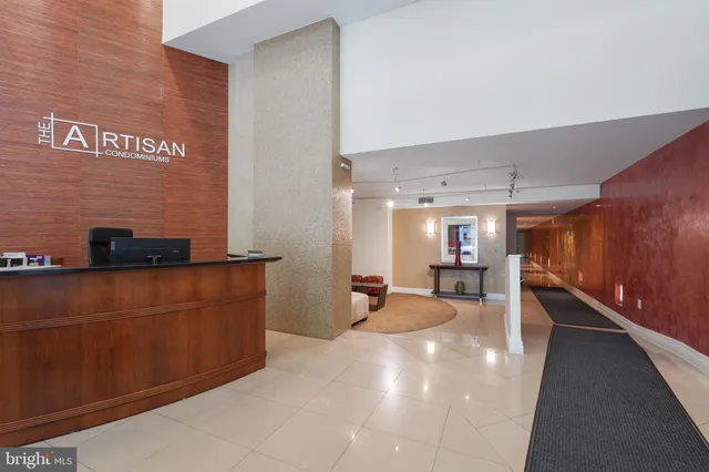 a lobby with furniture and a window