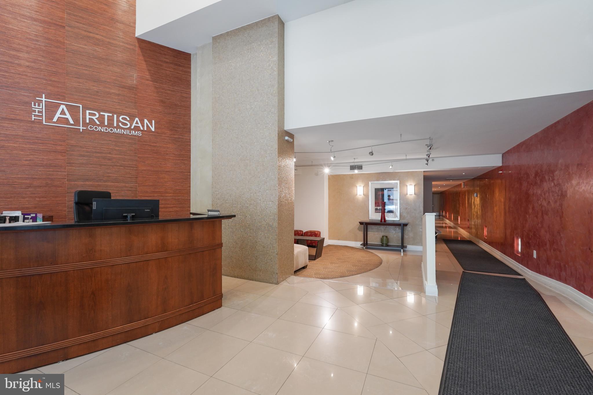 915 E Street Northwest, Unit 602 Washington, DC 20004 - Photo 2 of 23 a lobby with furniture and a window