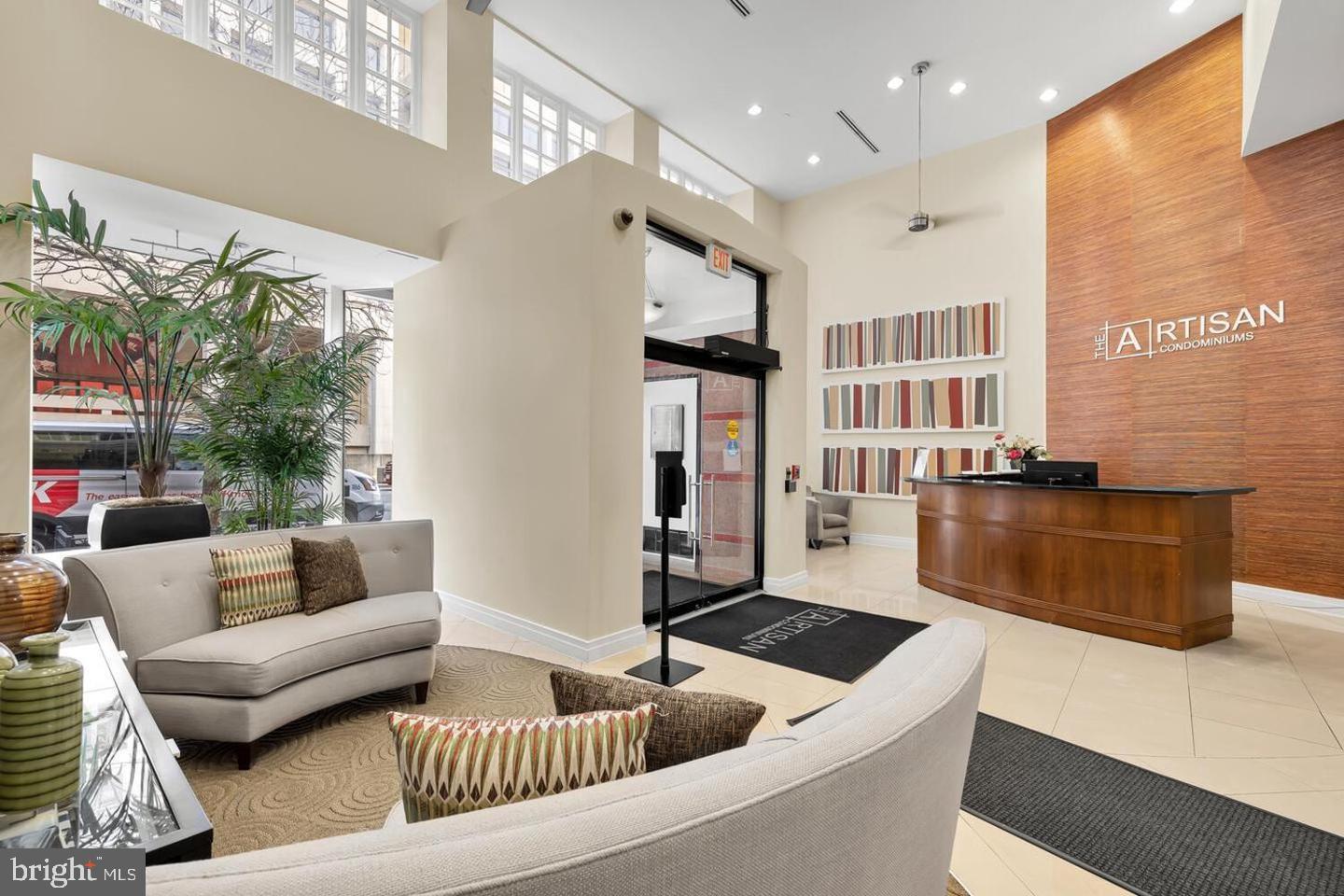 915 E Street Northwest, Unit 602 Washington, DC 20004 - Photo 3 of 23 a kitchen with stainless steel appliances granite countertop a sink and a refrigerator