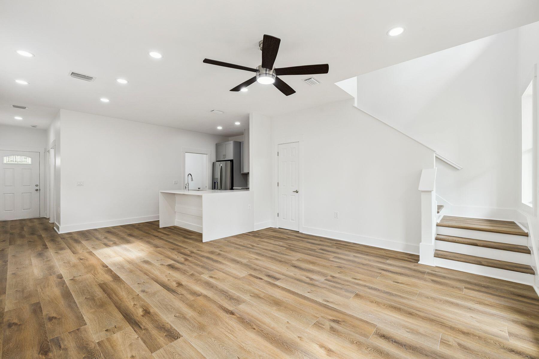 48 Pine Tree Way Santa Rosa Beach, FL 32459 - Photo 14 of 65 a view of empty room with wooden floor and ceiling fan