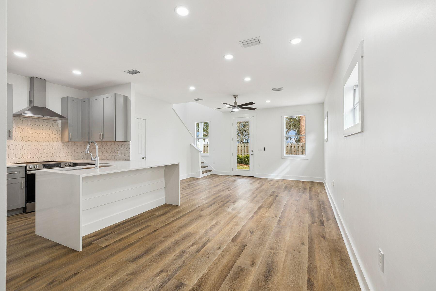 48 Pine Tree Way Santa Rosa Beach, FL 32459 - Photo 15 of 65 a large kitchen with stainless steel appliances granite countertop a stove and a refrigerator