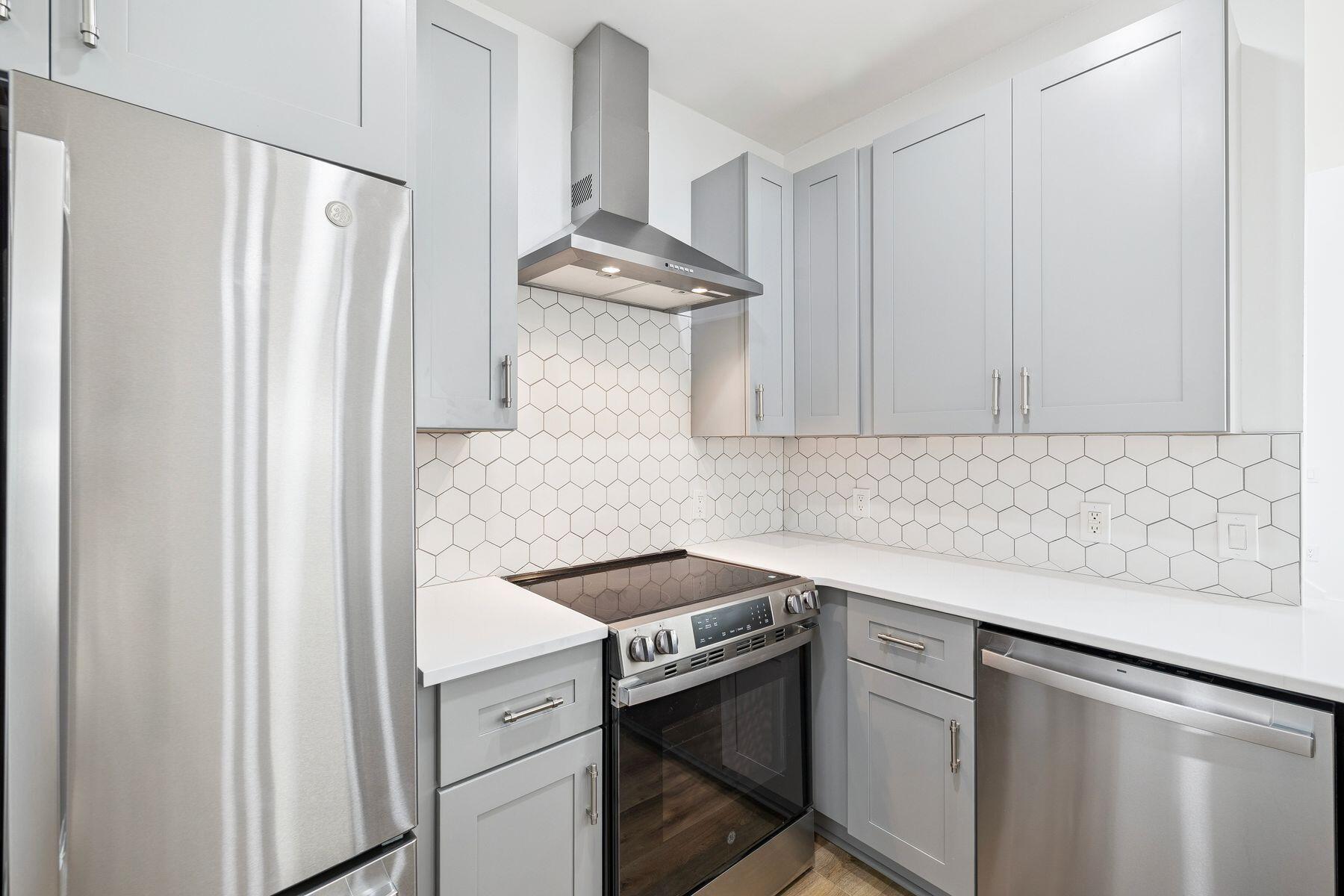 48 Pine Tree Way Santa Rosa Beach, FL 32459 - Photo 18 of 65 a kitchen with stainless steel appliances a sink stove and refrigerator