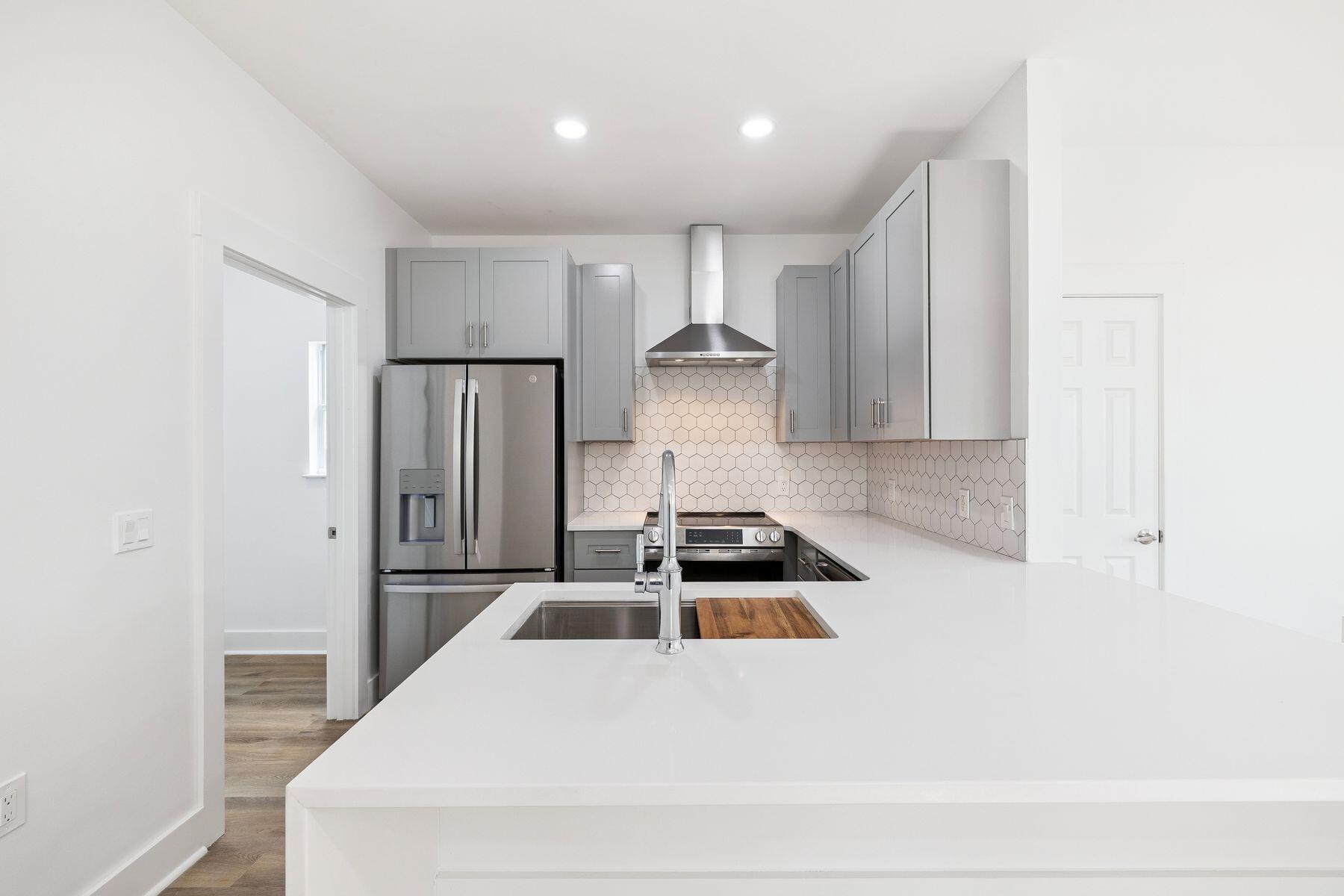 48 Pine Tree Way Santa Rosa Beach, FL 32459 - Photo 20 of 65 a kitchen with kitchen island a sink a stove and refrigerator