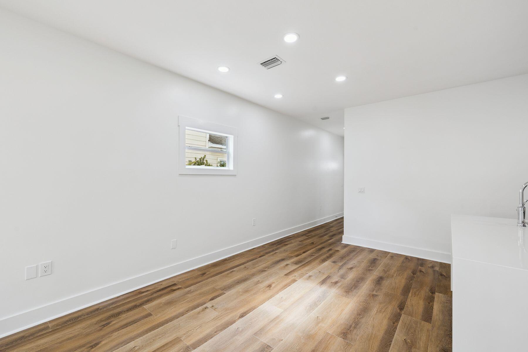 48 Pine Tree Way Santa Rosa Beach, FL 32459 - Photo 21 of 65 an empty room with wooden floor and windows