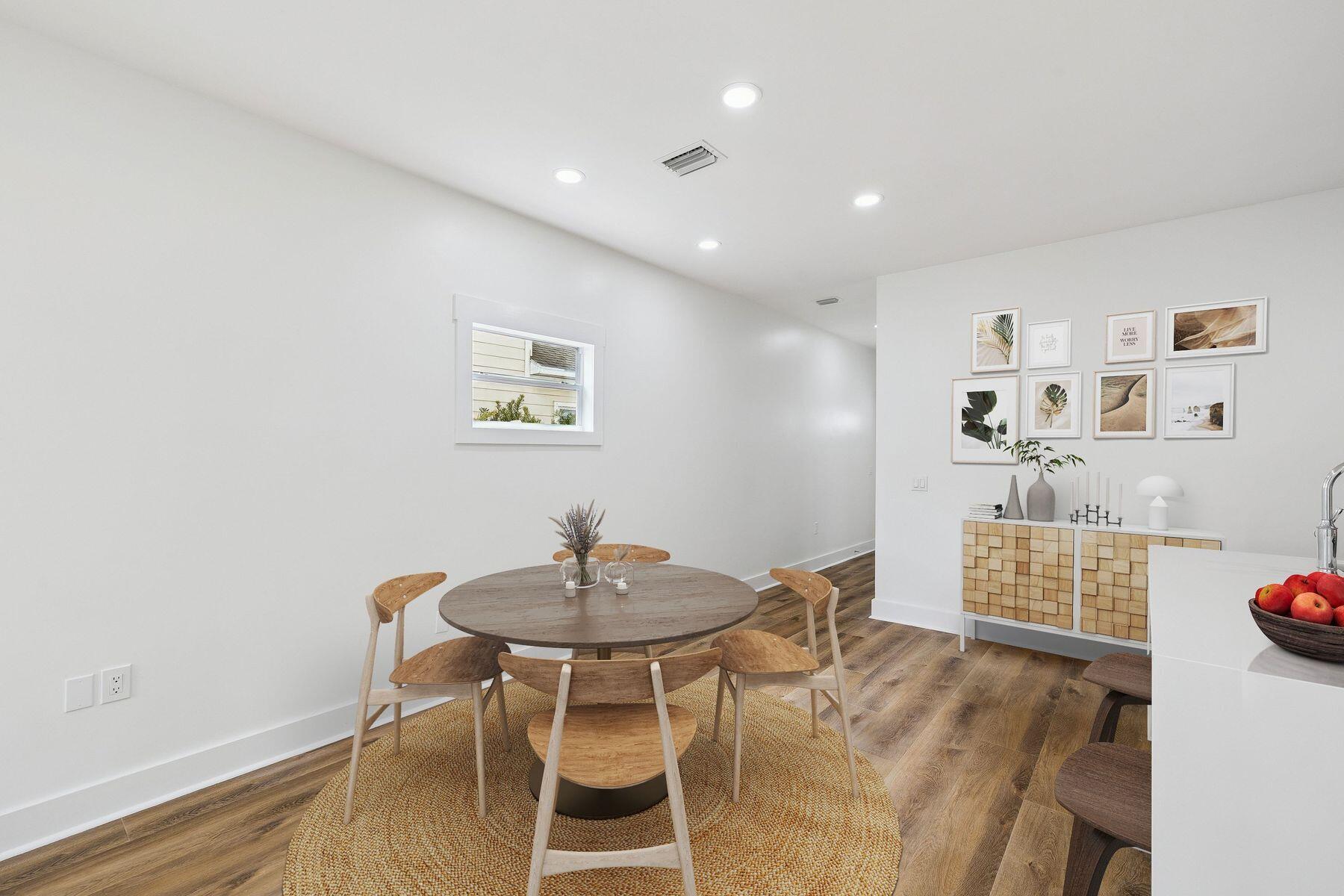 48 Pine Tree Way Santa Rosa Beach, FL 32459 - Photo 22 of 65 a view of a dining room with furniture and wooden floor