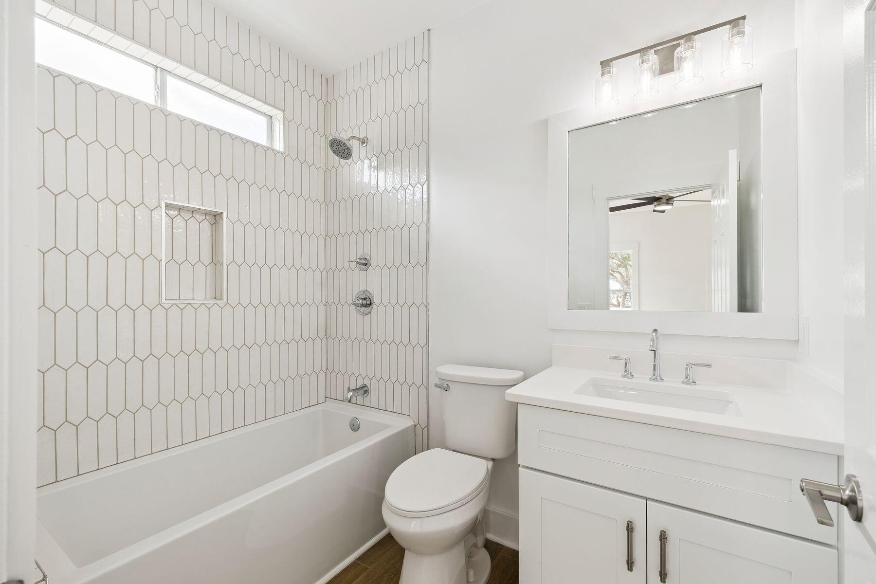 48 Pine Tree Way Santa Rosa Beach, FL 32459 - Photo 29 of 65 a bathroom with a sink toilet and shower