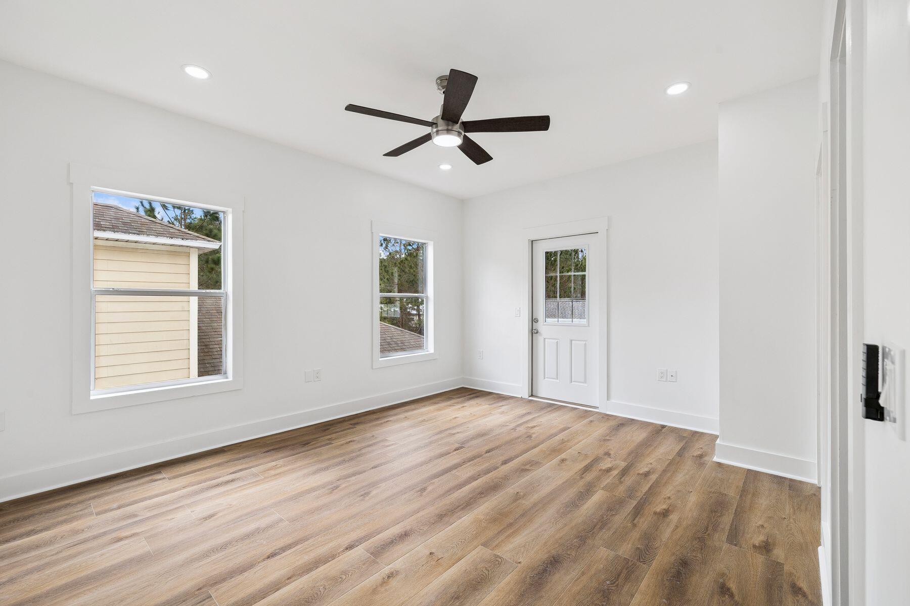 48 Pine Tree Way Santa Rosa Beach, FL 32459 - Photo 31 of 65 a view of empty room with wooden floor and fan
