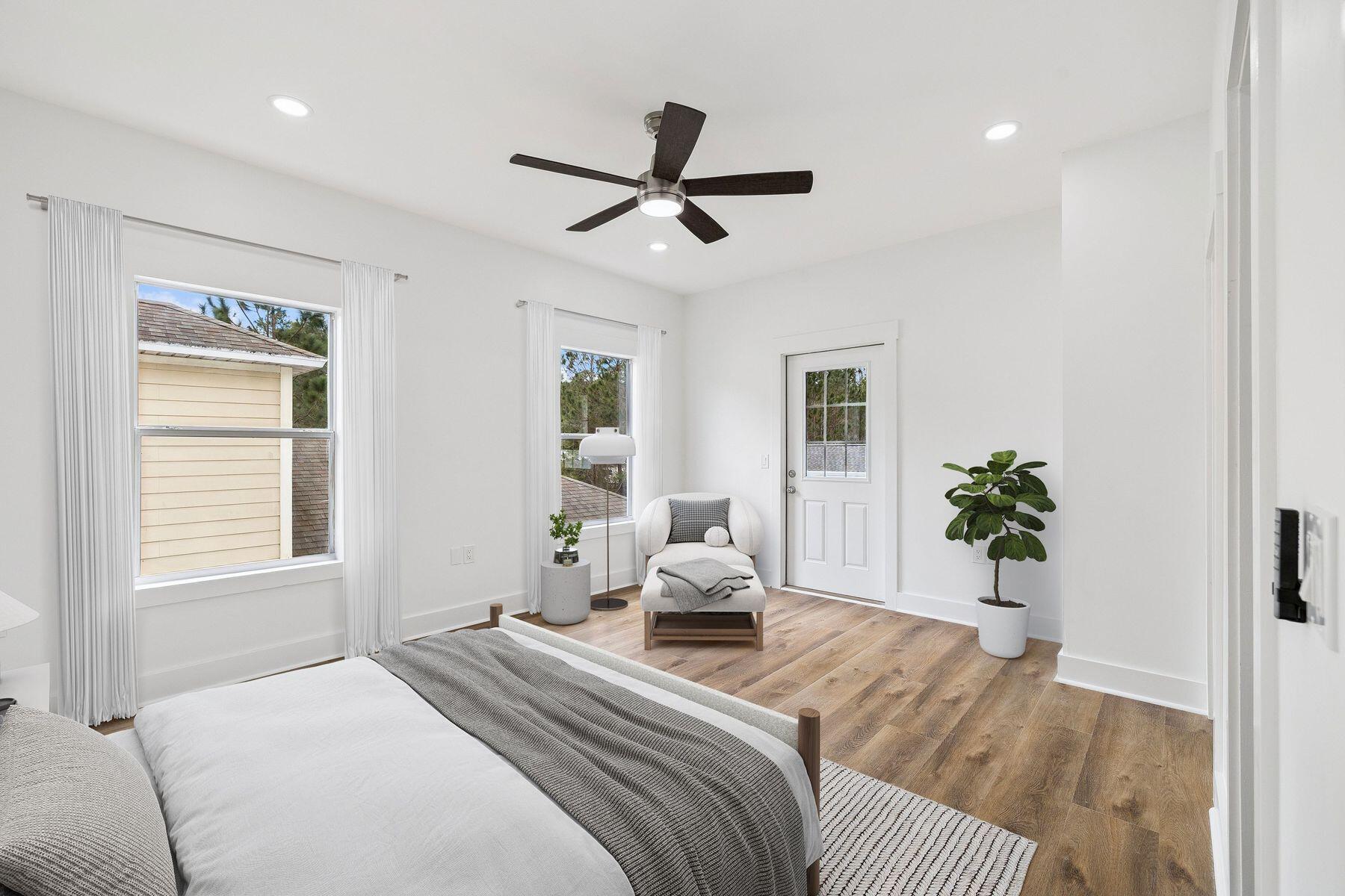 48 Pine Tree Way Santa Rosa Beach, FL 32459 - Photo 32 of 65 a bedroom with a bed and wooden floor