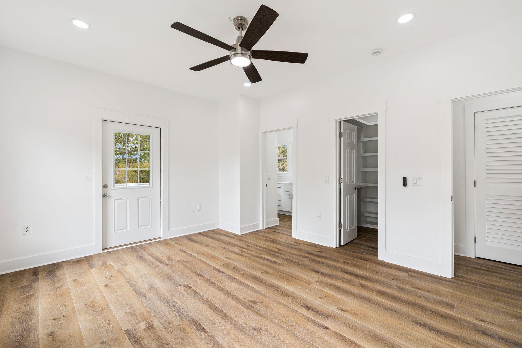48 Pine Tree Way Santa Rosa Beach, FL 32459 - Photo 33 of 65 wooden floor in an empty room with a window