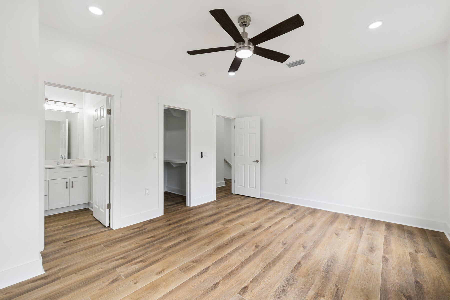 48 Pine Tree Way Santa Rosa Beach, FL 32459 - Photo 34 of 65 a view of a livingroom with wooden floor and a ceiling fan