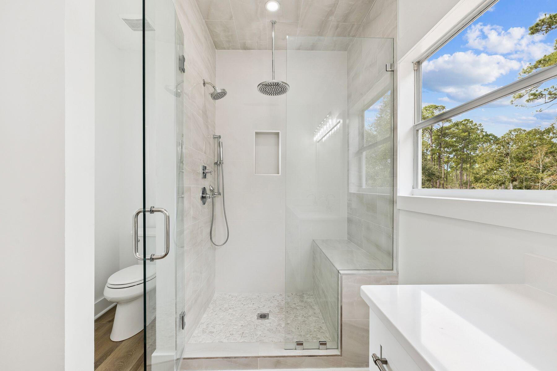 48 Pine Tree Way Santa Rosa Beach, FL 32459 - Photo 37 of 65 a bathroom with a shower and a tub