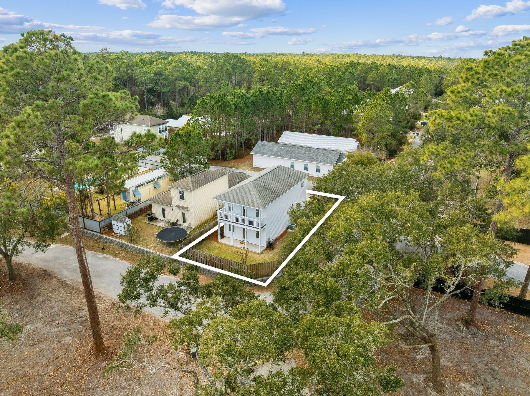 48 Pine Tree Way Santa Rosa Beach, FL 32459 - Photo 44 of 65 a view of a house with a yard and sitting area