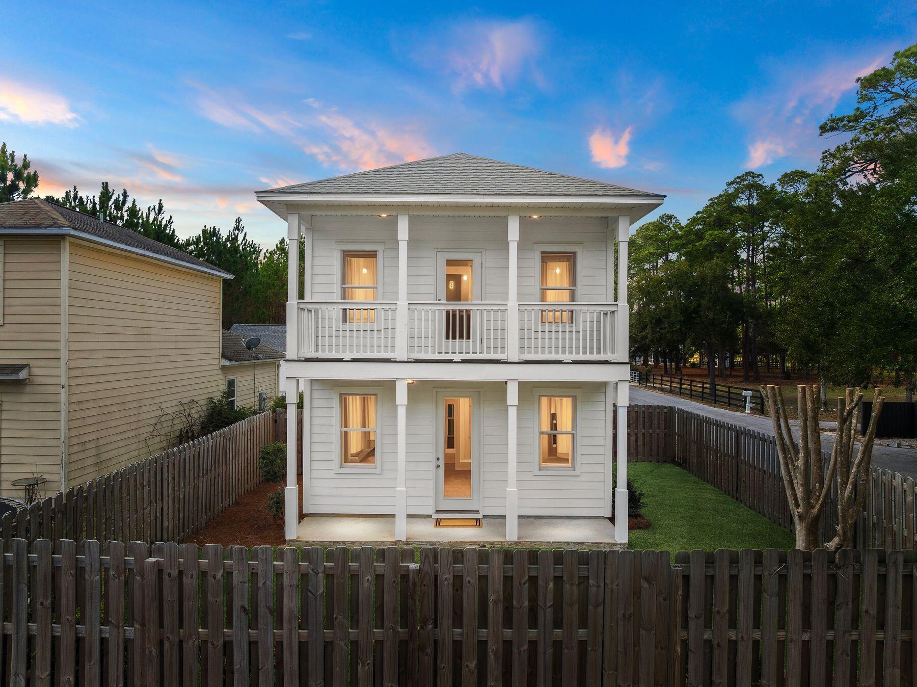 48 Pine Tree Way Santa Rosa Beach, FL 32459 - Photo 46 of 65 a front view of a house with a yard