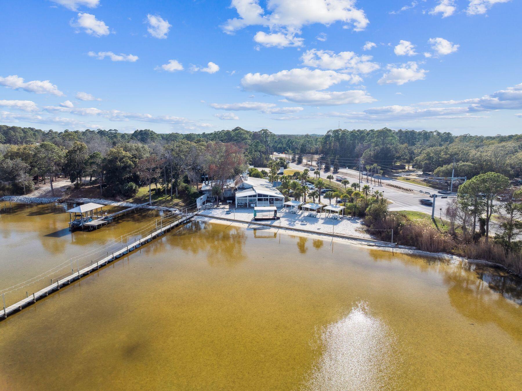 48 Pine Tree Way Santa Rosa Beach, FL 32459 - Photo 53 of 65 a view of a swimming pool with outdoor seating