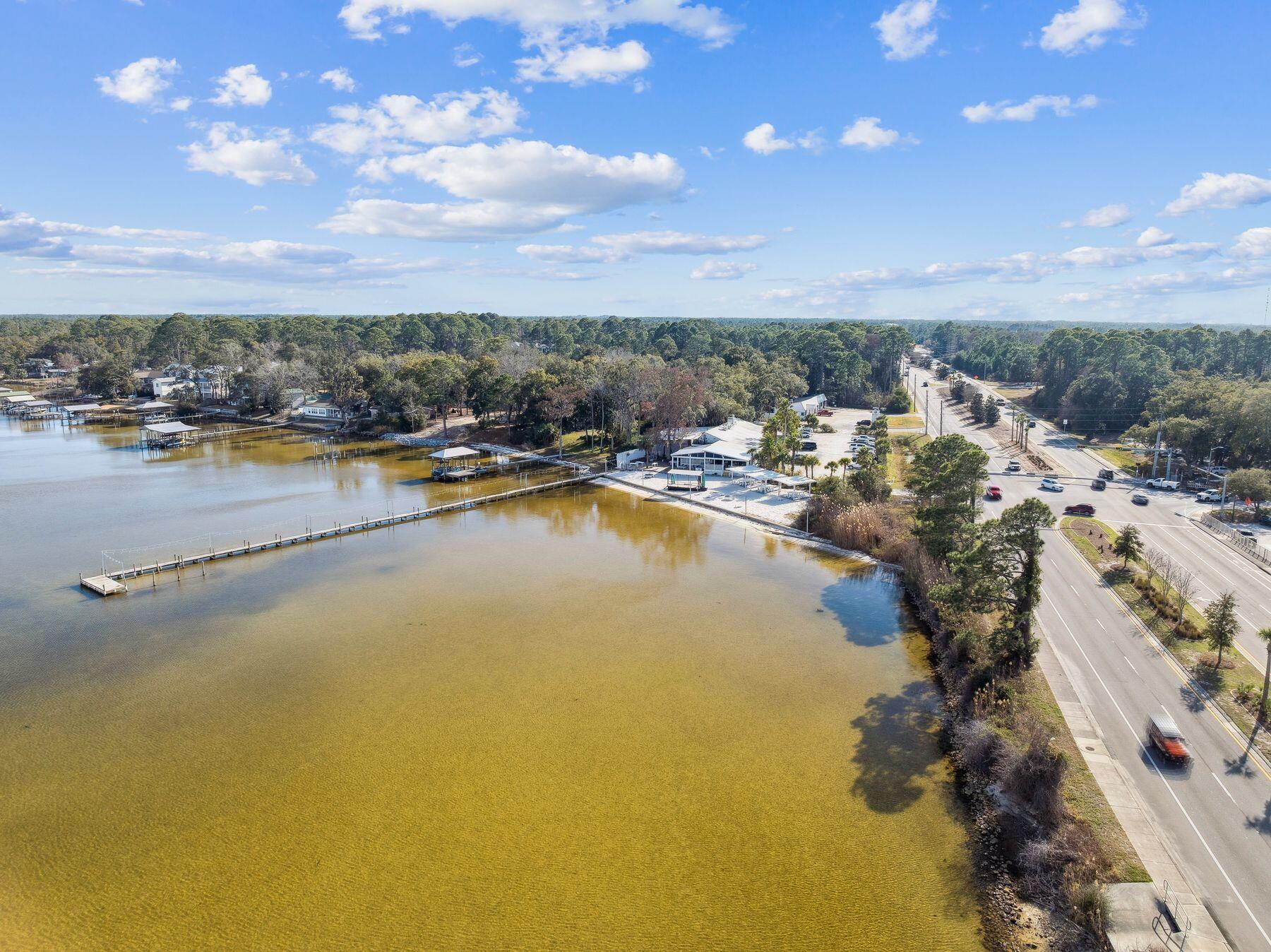 48 Pine Tree Way Santa Rosa Beach, FL 32459 - Photo 57 of 65 a view of a lake with a city