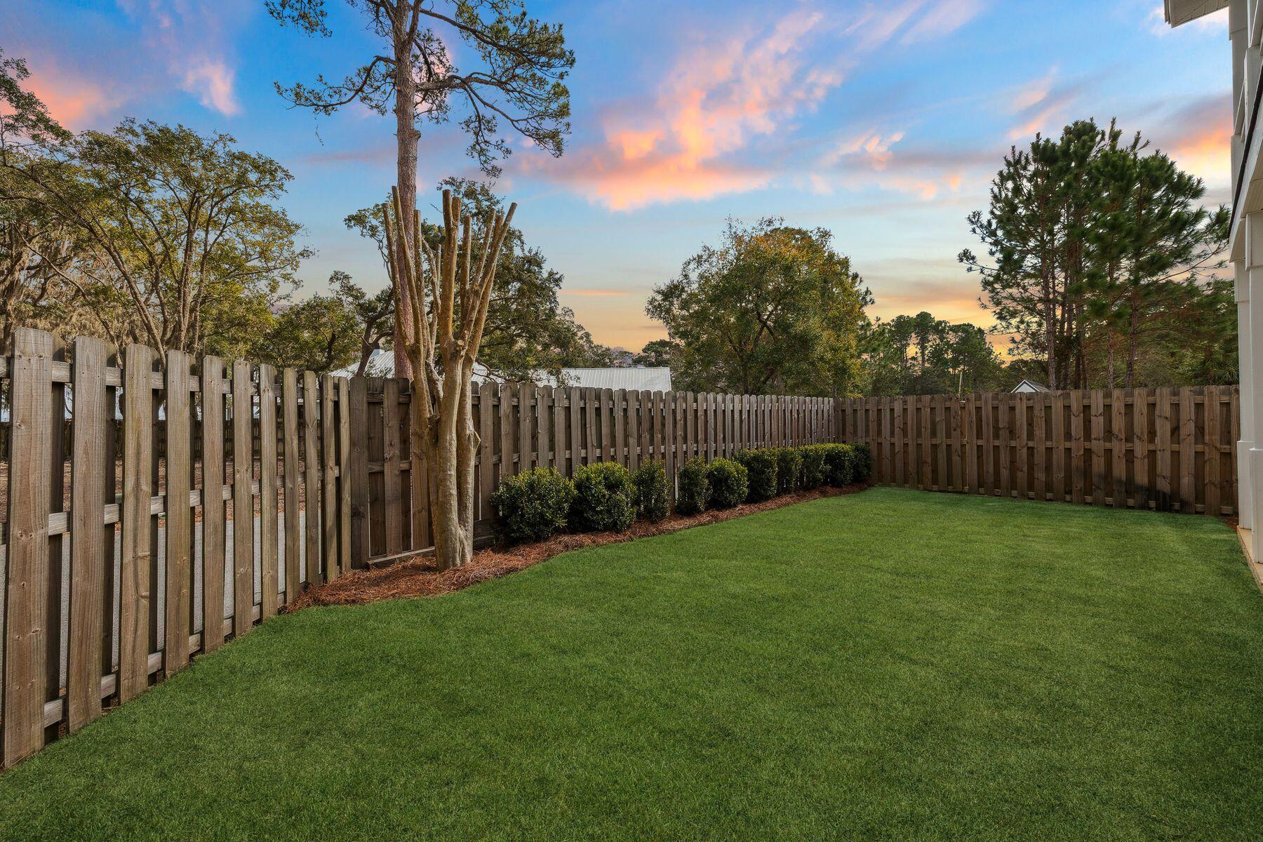 48 Pine Tree Way Santa Rosa Beach, FL 32459 - Photo 6 of 65 a view of a backyard with green space