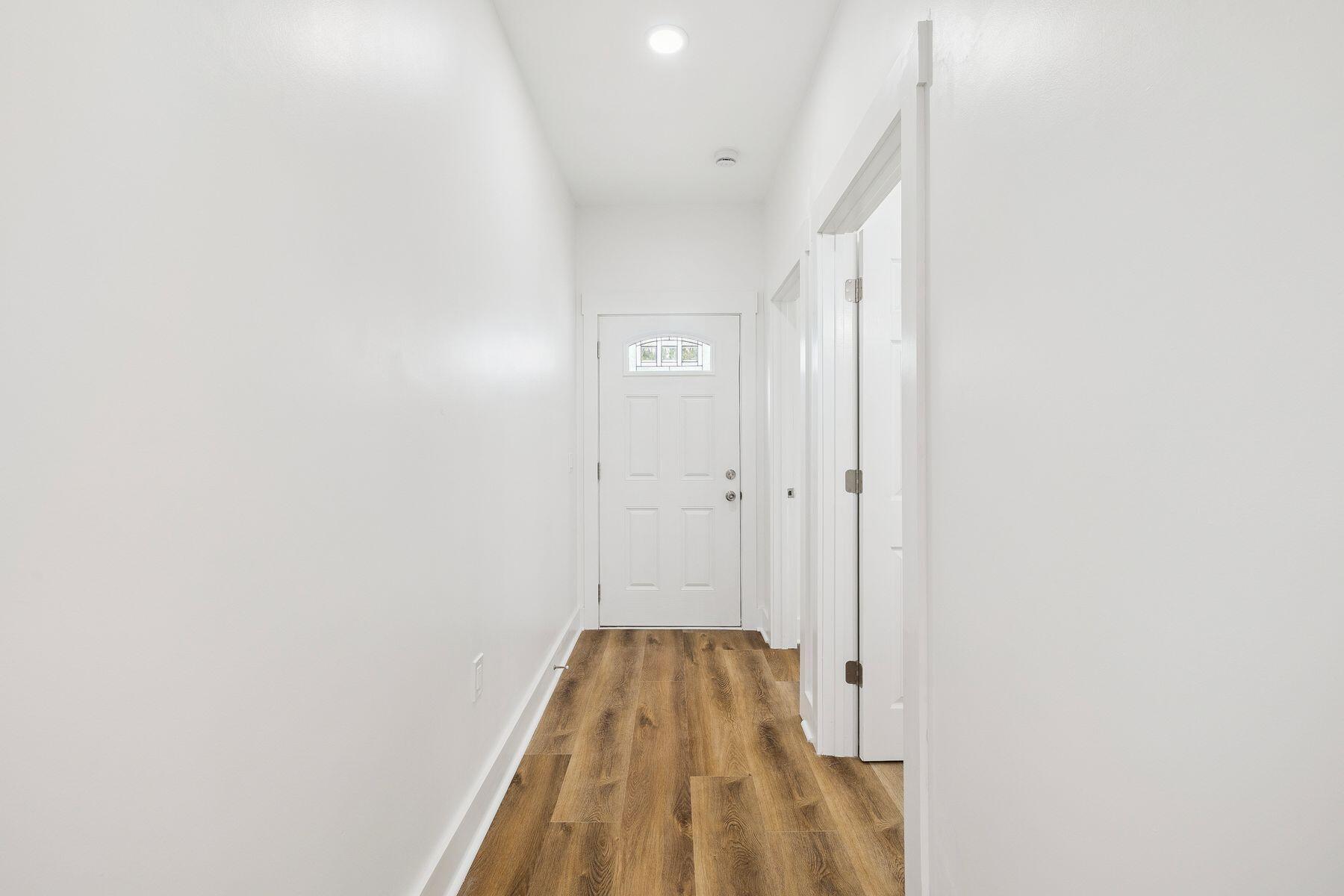 48 Pine Tree Way Santa Rosa Beach, FL 32459 - Photo 8 of 65 a view of a hallway with wooden floor