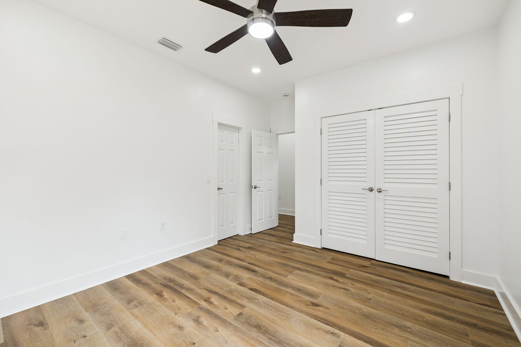 48 Pine Tree Way Santa Rosa Beach, FL 32459 - Photo 10 of 65 a view of empty room with wooden floor