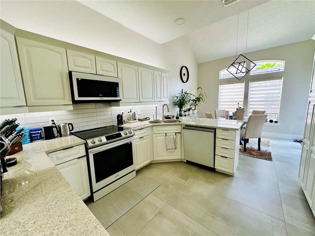 784 South Pennsylvania Avenue Winter Park, FL 32789 - Photo 9 of 29 a kitchen with a sink stove top oven and microwave