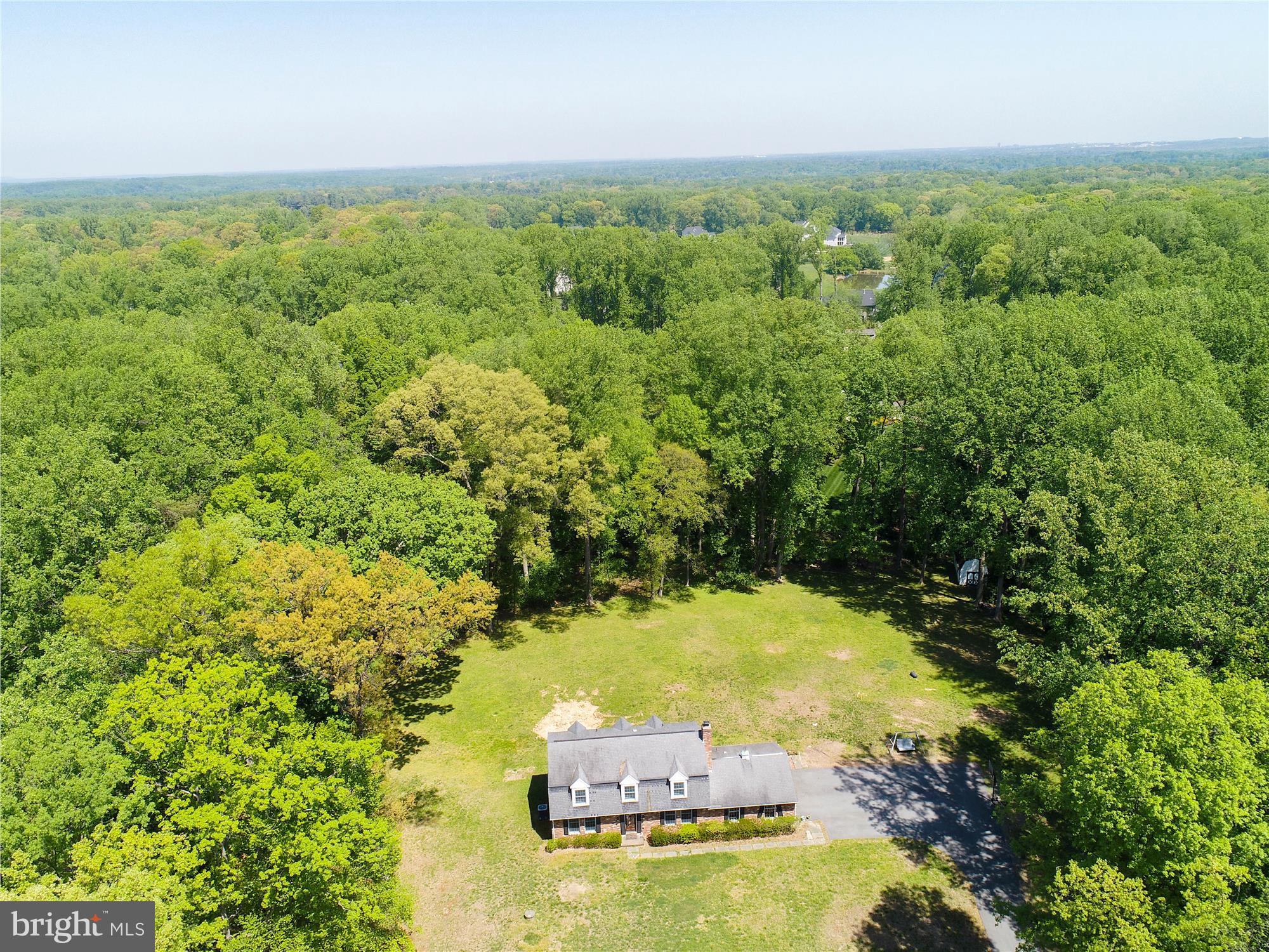 10422 Deerfoot Drive Great Falls, VA 22066 - Photo 1 of 15 a view of an outdoor space and a yard