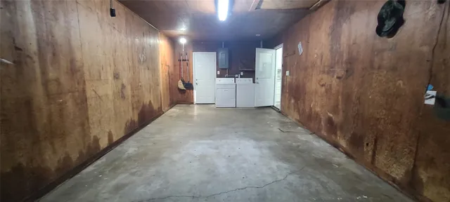 a view of a hallway with stainless steel appliances granite countertop furniture