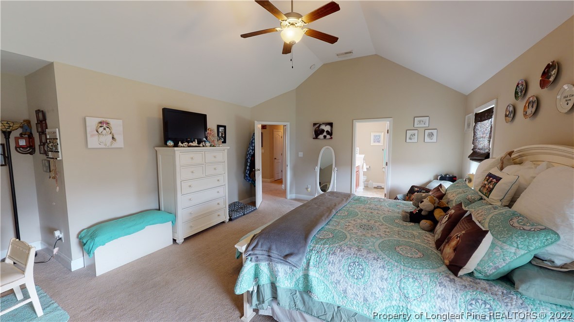 3428 Park Hill Road Fayetteville, NC 28311 - Photo 11 of 29 a spacious bedroom with a bed and a flat screen tv