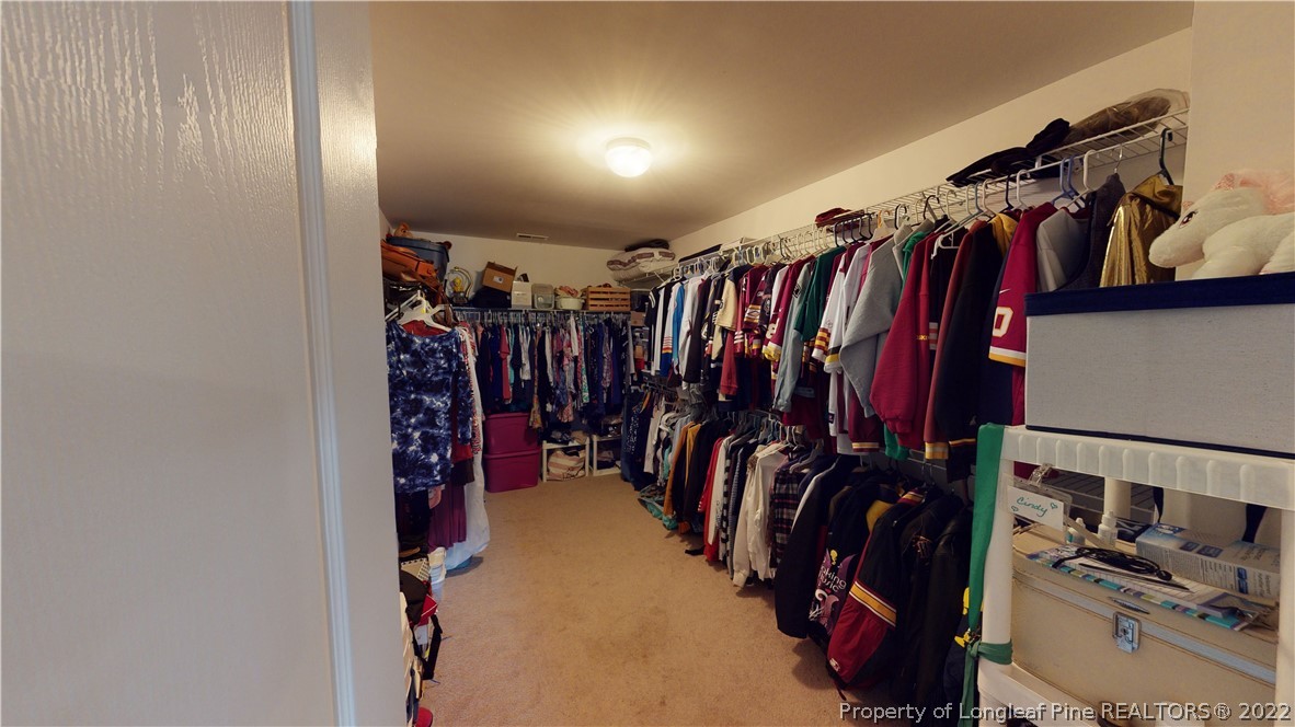 3428 Park Hill Road Fayetteville, NC 28311 - Photo 13 of 29 a view of walk in closet with clothes and shoes